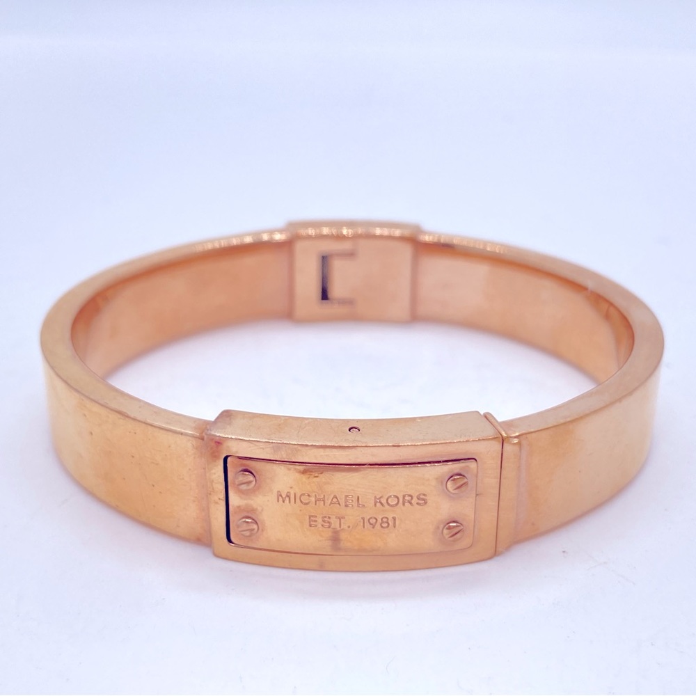 Michael Kors Gold Tone Hinged Bangle Bracelet With Logo